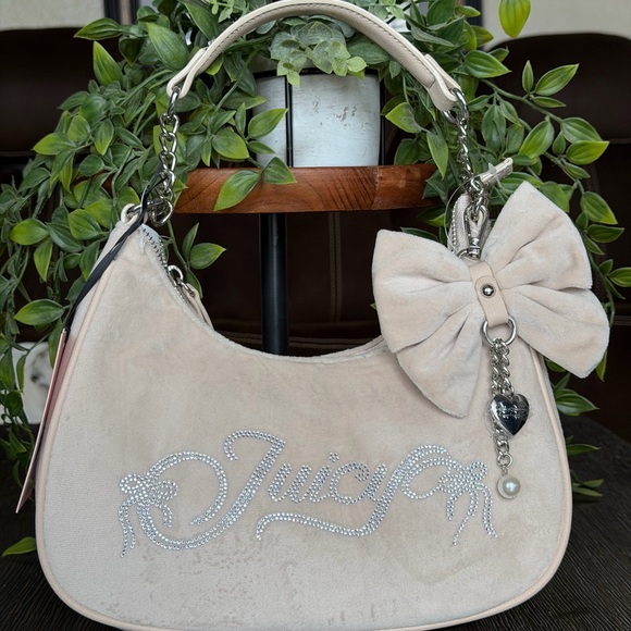 Juicy Couture Handbags - Juicy Couture Beige Shoulder Bag with Bow and Charm